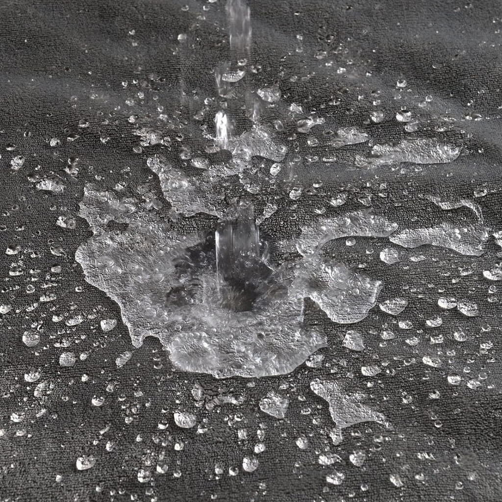 Water splashing on platinum gray aquashield waterproof blanket 